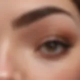 A close-up of perfectly groomed thick eyebrows showcasing elegance and beauty.